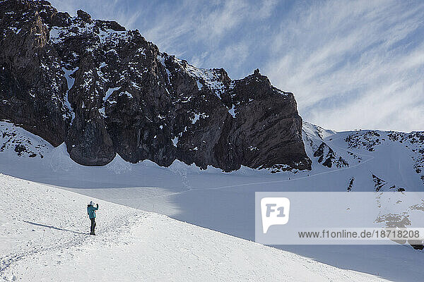 A Climber Pauses to Take a Photograph Above Camp Muir on Mt Rainier