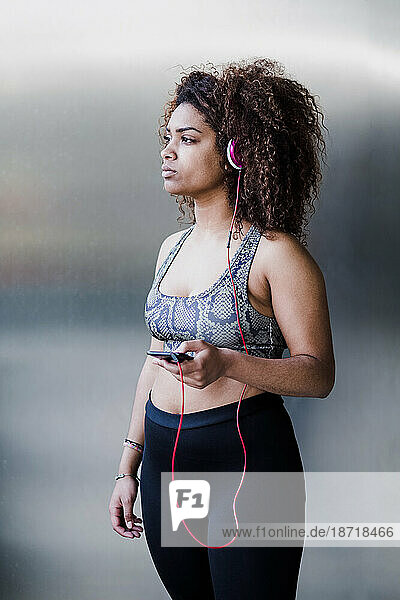 Curvy African American Woman Working Out and Listening Music