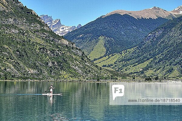 Lady paddle boarding on a lake in Chile