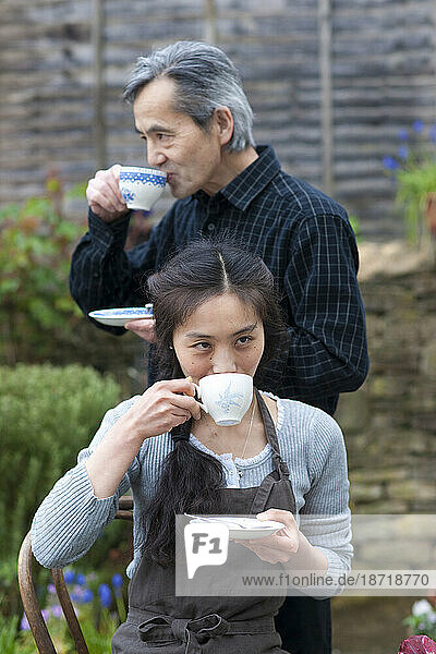 A man and his daughter share tea at Juri's Tea room in Winchcombe  England.