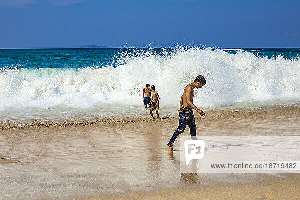 Young boys playing near the ocean.Sumbawa.Indonesia.