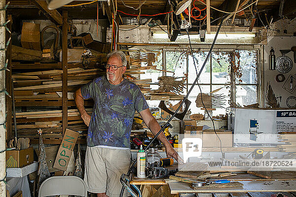Portrait of a proud craftsman in his workshop