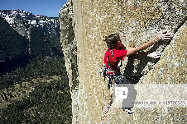 A man attempting to free-climb the Mescalito route on El Cap in Yosemite National Park  California.
