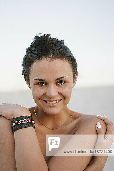 close up portrait of smiling woman on the beach
