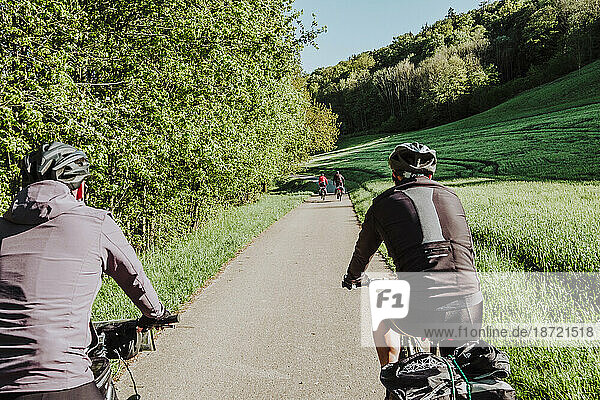 Cyclists riding his bikes in the forest  Romantische Strasse route