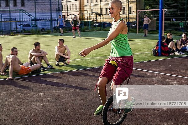 Teenager Girl Riding Unicycles At The Park Of Saint Petersburg  Russia