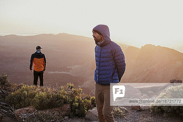 Hikers at sunrise in the top of Guajara Mountain  Tenerife