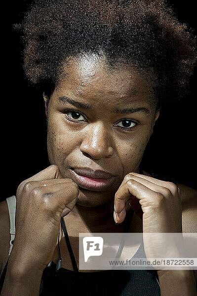 Portrait of female boxer holding hands in defensive position  Toronto  Ontario.