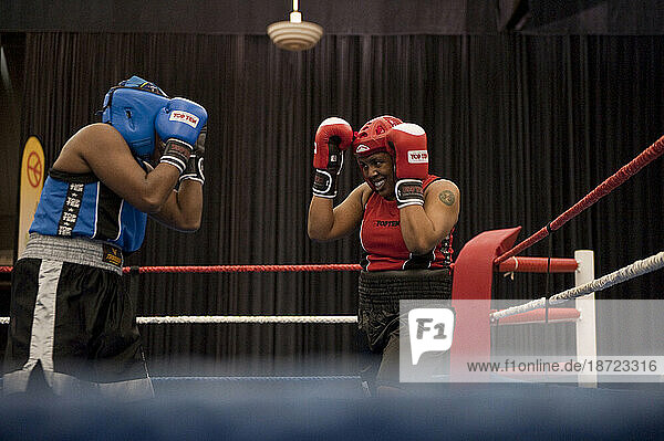 A female boxer defends herself during a semi-final match at the Canadian Amateur Boxing Championships in Saint-Hyacinthe  Quebec.