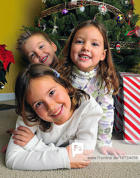 Portrait: Children smile for their Christmas card