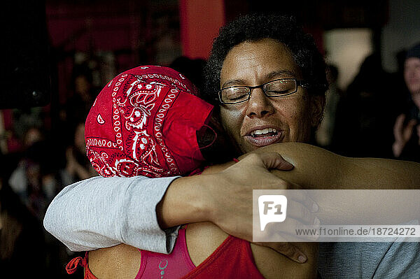 Female coach and female boxer embrace after victorious fight  Toronto  Ontario
