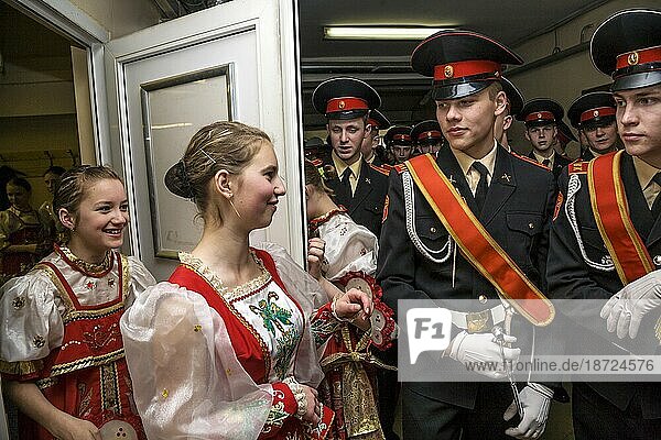 Russian Cadets And Young Woman In Russian National Clothes
