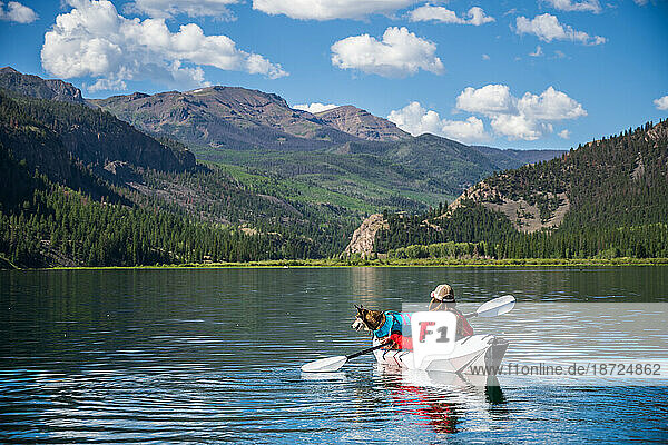 Woman with Dog Kayaking on lake San Cristobal in Colorado