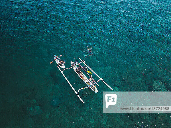 Outrigger and kayak in sea Â Amed  Bali  Indonesia