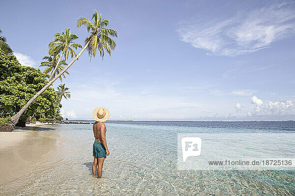 Fit man  at tropical sandy beach  during sunny summer day  Samoa