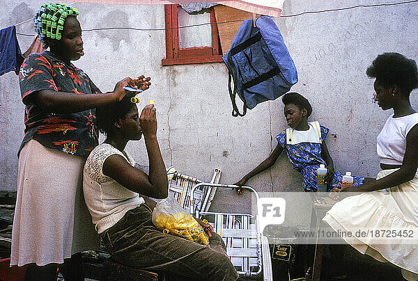 Women braid their hair in Kingston  Jamaica