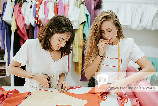 Fashion designers working together in the design studio