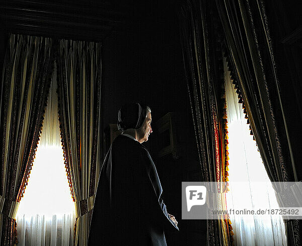 Portrait of a nun by a window at the Motherhouse in Villa Walsh Morristown  NJ