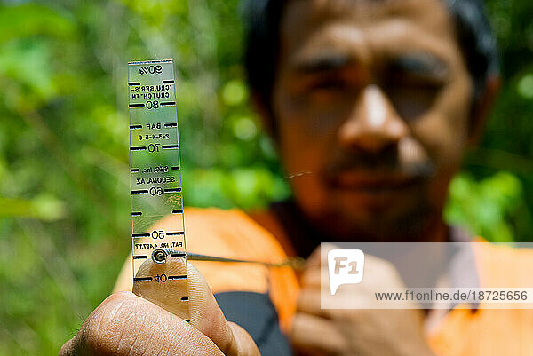 An Indonesian village conservation council demonstrates carbon monitoring techniques.
