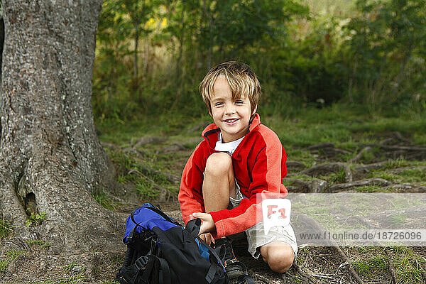 Young boy out hiking