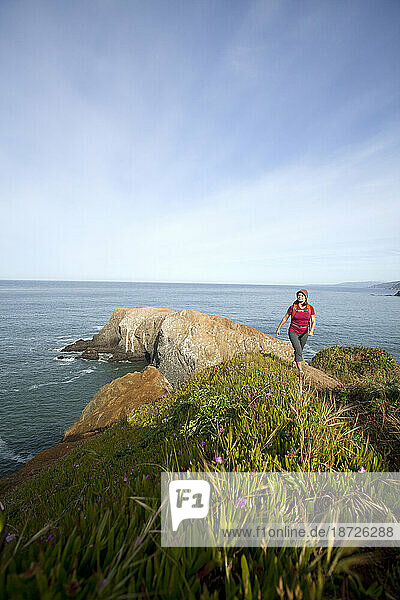 Young woman hiking in the Marin Headlands. Golden Gate National Recreation Area. San Francisco  CA