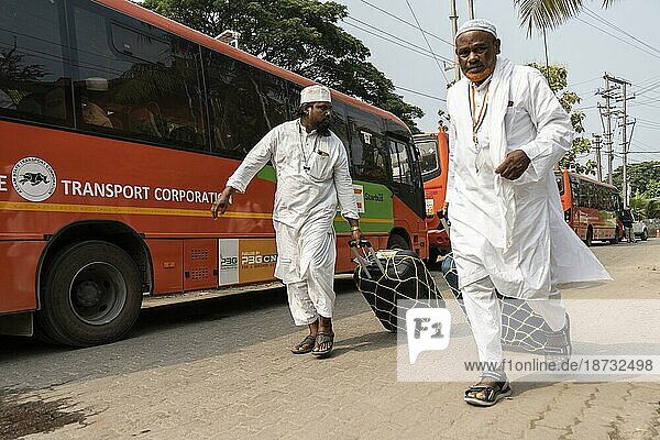GUWAHATI  INDIA  JUNE 7: Haj pilgrims inside a bus as they leaving to airport for Mecca  on June 7  2023 in Guwahati  India. The Hajj pilgrimage is an important religious journey undertaken by millions of Muslims from around the world. It is one of the Five Pillars of Islam and is a mandatory act of worship for able-bodied and financially capable Muslims. The pilgrimage takes place in Mecca  Saudi Arabia  during the Islamic month of Dhul Hijjah  Asia