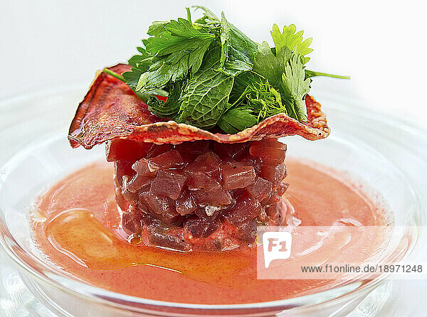 Tuna timbale with grilled Parma ham