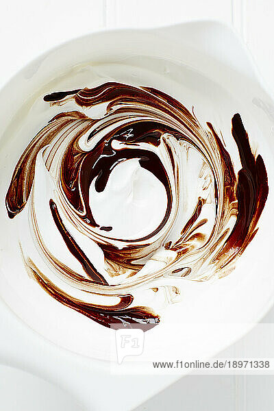 Stirring chocolate into meringue mixture