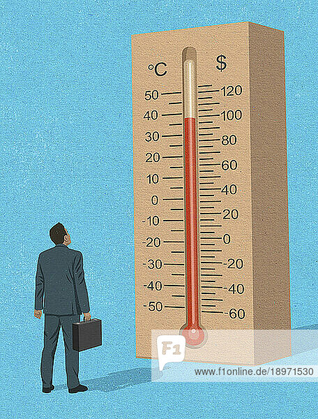 Geschäftsmann schaut auf ein Dollar-Thermometer