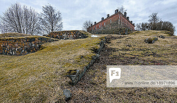 A historic site  a building and archaeological site  the island fortress of Suomenlinna  walls and ditches of the fort and a building.