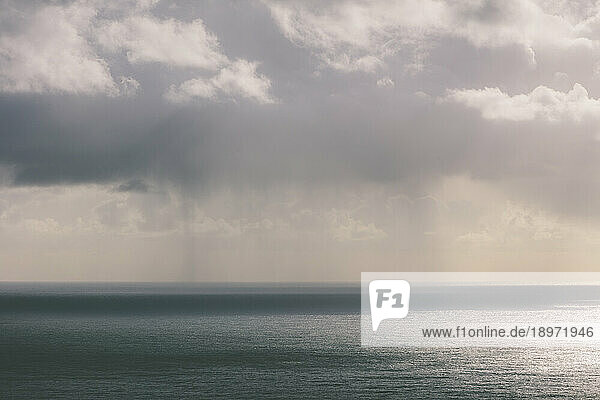 Storm clouds over the Pacific ocean at dusk