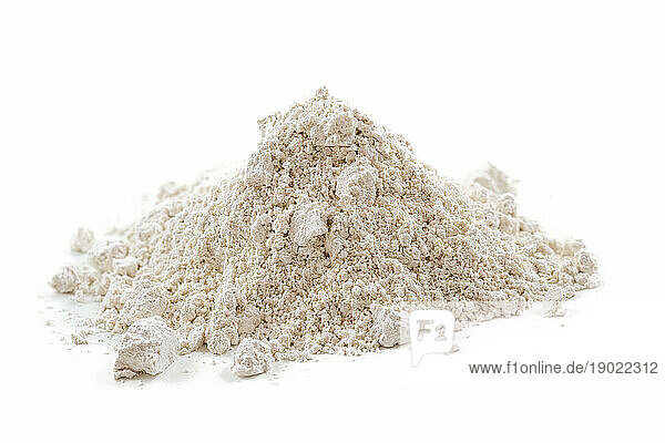 Heap of ultra ventilated white clay on white background.