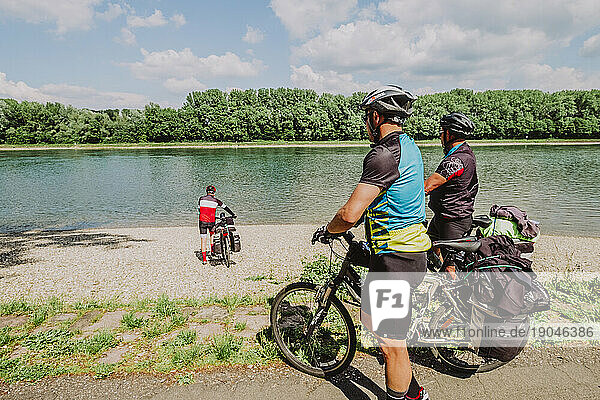 A Group of cyclists have fun in the Rin river  Germany