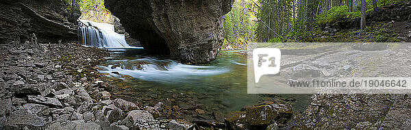 Rushing water carves a path through the limestone of Johnston Canyon in Banff National Park  Alberta  Canada.
