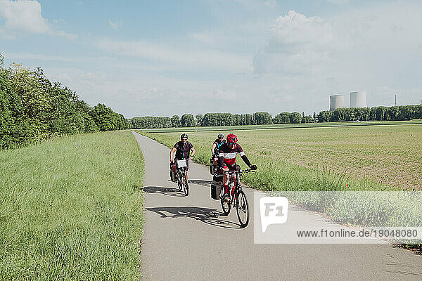 A group of cyclists riding his bikes in the Rin river route in Germany