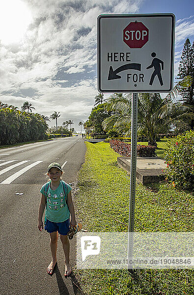 Stop for Pedestrian sign pointing at child  Kauai