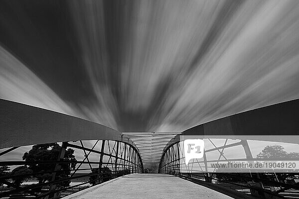 pedestrian bridge in chicago the dreamy clouds. Long exposition