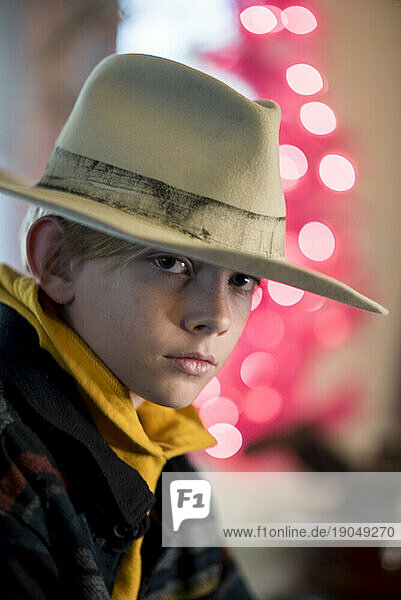 Portrait of boy wearing large hold hat
