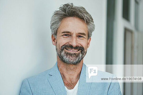 Portrait of smiling businessman with beard