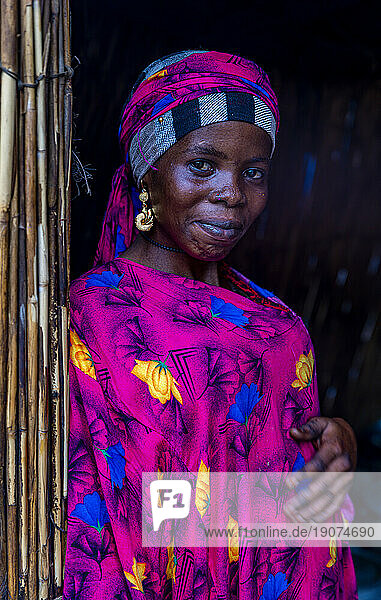 Portrait of a local woman in bright pink clothes,  Lake Chad,  Chad,  Africa