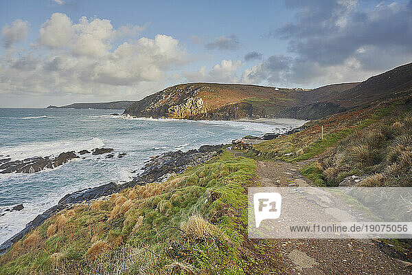 The cliffs and sands of Portheras Cove, a remote beach near Pendeen, on the rugged Atlantic cliffs of the far west of Cornwall, England, United Kingdom, Europe