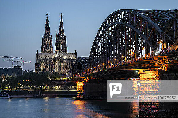 Cologne Cathedral  UNESCO World Heritage Site  and Hohenzollern Bridge at dusk  Cologne  North Rhine-Westphalia  Germany  Europe