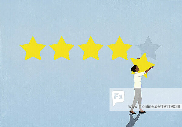 Woman removing rating star from blue background