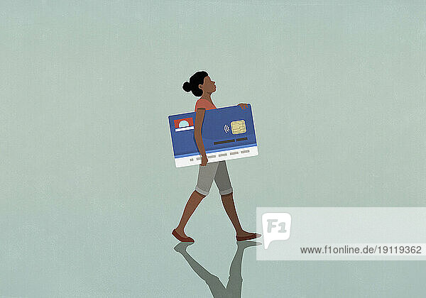 Female consumer carrying large credit card