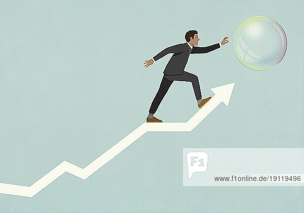 Businessman trying to pop bubble on ascending arrow