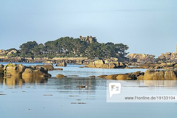 The rocks of the pink granite coast Côte de Granit Rose at the Baie de Sainte Anne near Tregastel and Costaeres Castle  Brittany  France  Europe