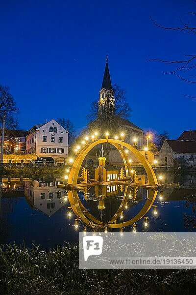 Floating candle arch in the village pond of Bärnsdorf near Moritzburg. The arch is 4.5m high  almost 8m wide and was built by local craftsmen as a special decoration for the local Christmas market