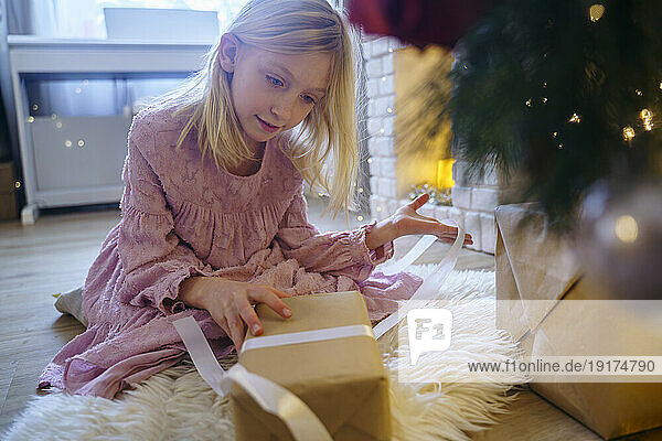 Girl looking at gift on Christmas vacation