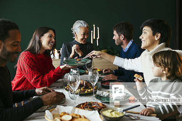 Happy family enjoying dinner at home on Christmas