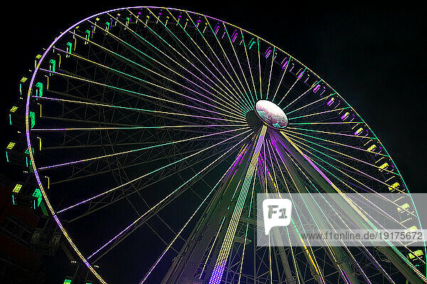 Germany  Bavaria  Wurzburg  Multiple exposure of spinning Ferris wheel at night
